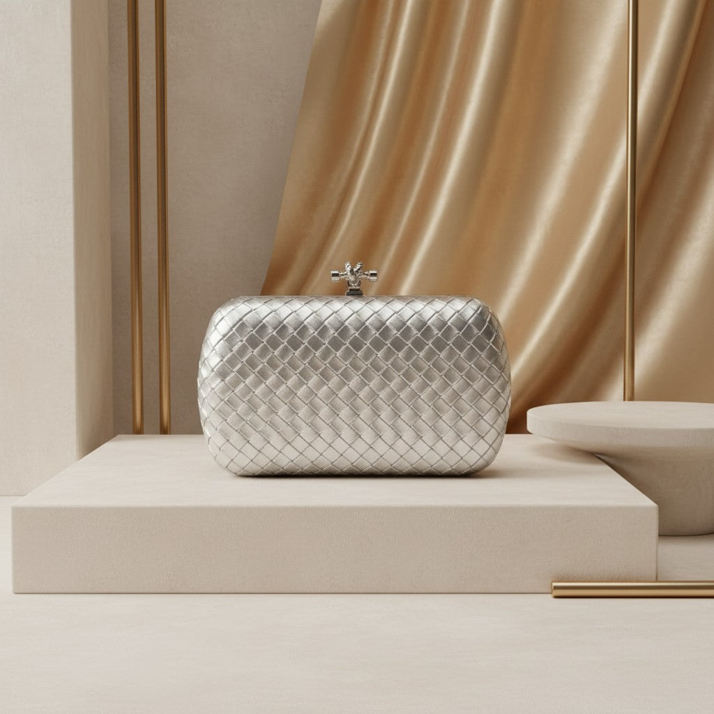 Silver woven metallic evening clutch with knot clasp