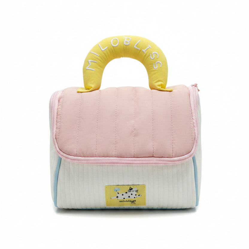 Pink pet carrier with yellow handle featuring 'LOBLISS' branding, displayed on a table.