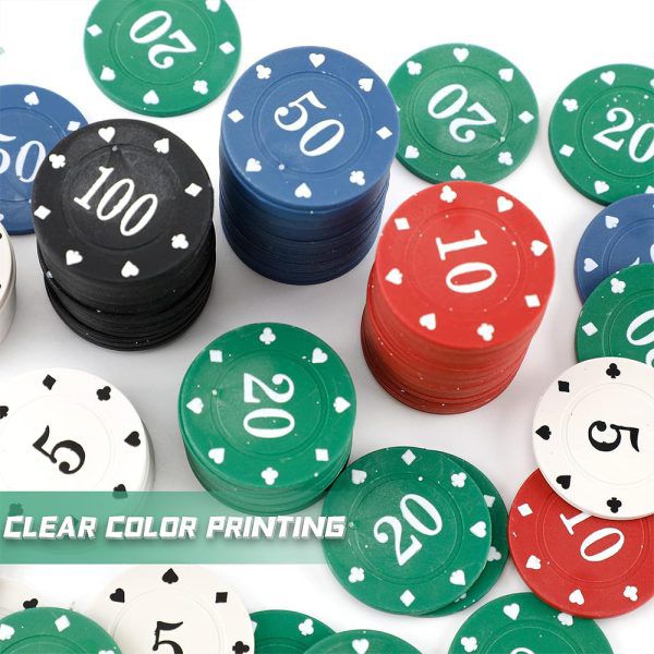 Scattered pile of poker chips in white, red, green, blue and black at an angle