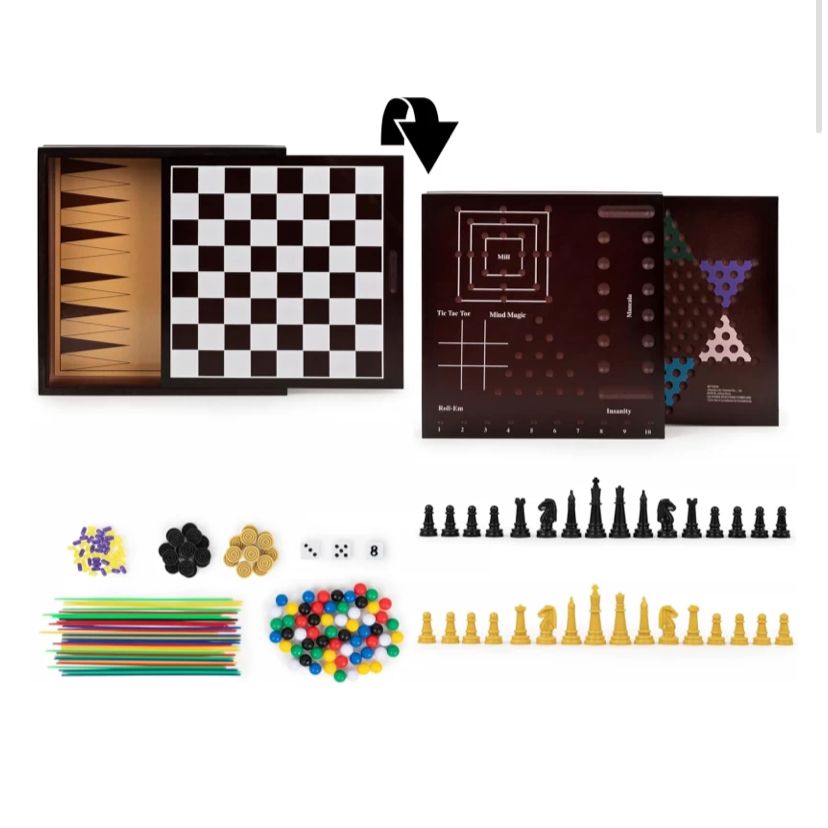 All the pieces laid out, chess, draughts, marbles, mancala stones, dice and pick up sticks