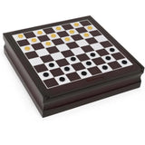 Gold and black draughts discs set out on the checkered top of the game cabinet