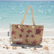 Beach bag with turtle design and 'Beirut' text on a sandy beach with ocean background
