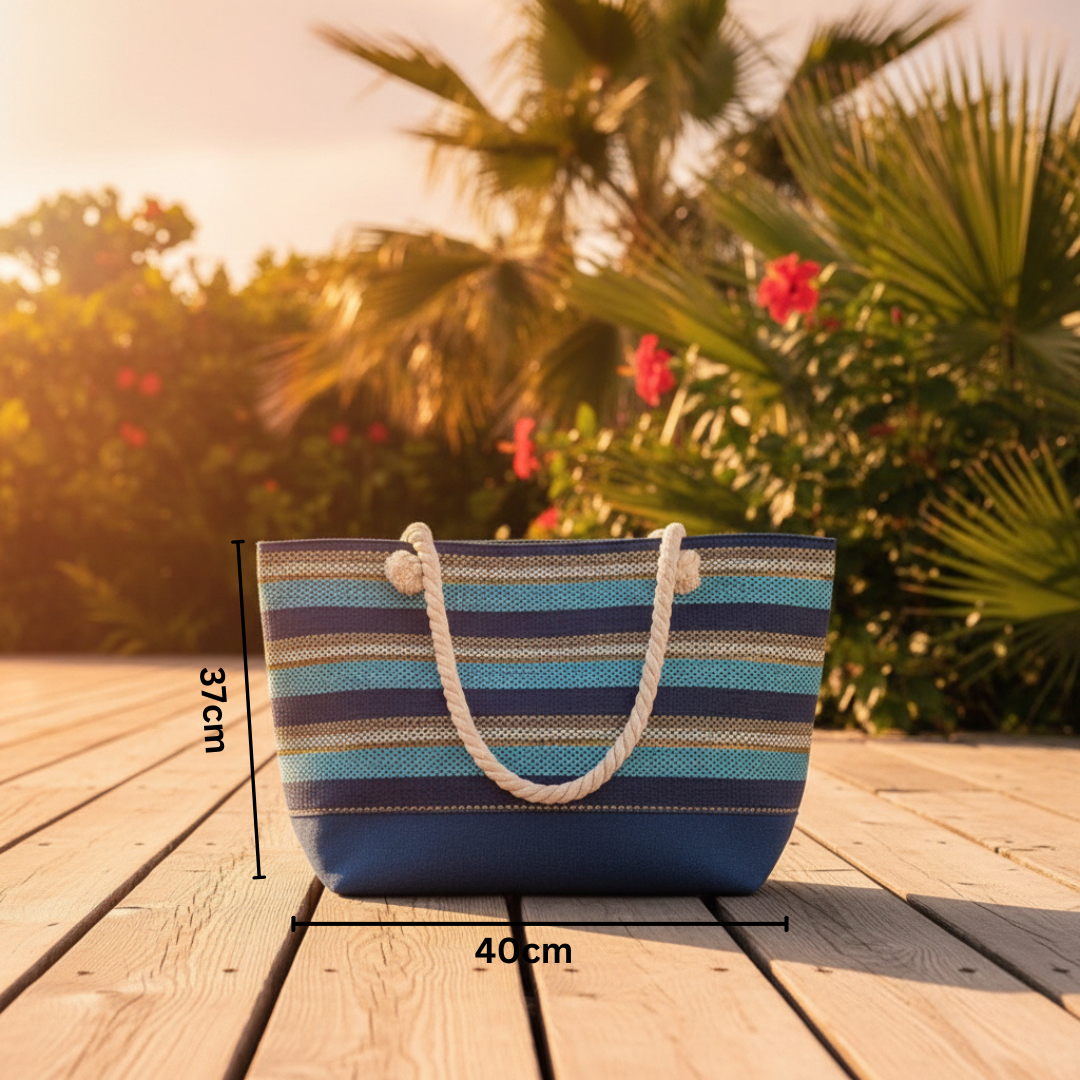 Striped beach bag on a wooden surface with palm trees and flowers in the background