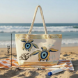 Beach bag with turtle design on sand by the ocean