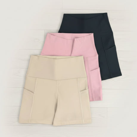 Beige, Pink and Black pocket biker shorts on a white background