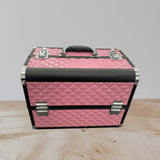 Pink quilted aluminium makeup case closed with black rails, chrome corners and latches