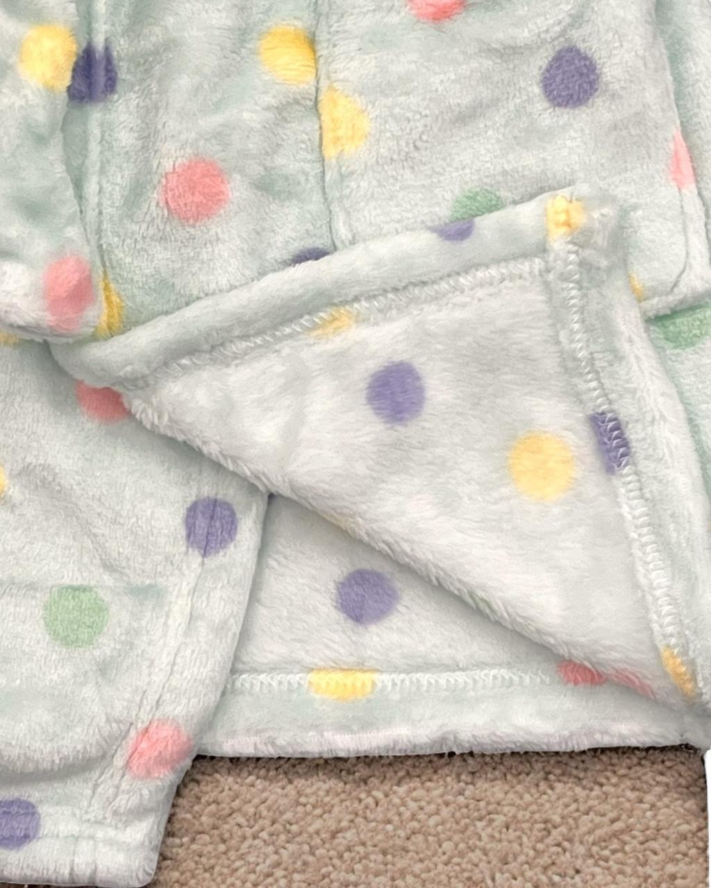 Close up of pastel dots and stitched hem on the soft mint fleece robe