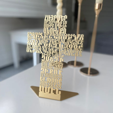 Matte gold Armenian letters cut right through to form a free standing cross