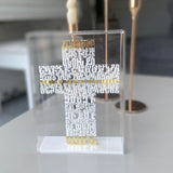 Raised white Armenian lettering forming a cross, three lines picked out in gold