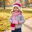 Baby pink kids knitted set with cream trimmed pom pom ear flap hat, ribbed scarf and striped mittens