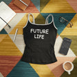 Black tank top with 'FUTURE LIFE' text on a colorful geometric-patterned rug.