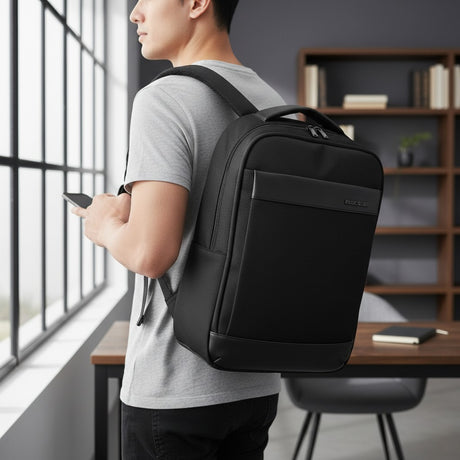 Person wearing a black backpack in an indoor setting with a desk and bookshelf
