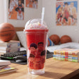Bright red tumbler with a bead filled dome lid and a cartoon basketball team print