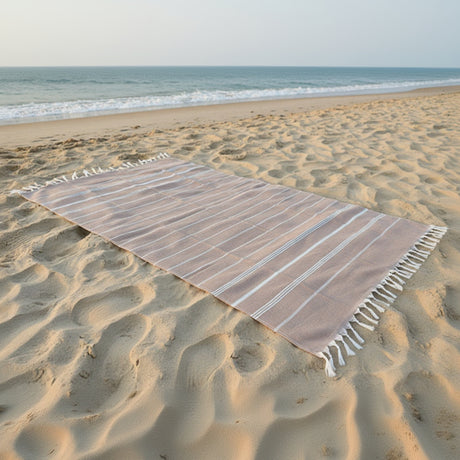 Lightweight quick-dry beige striped beach towel with tassel fringe detail