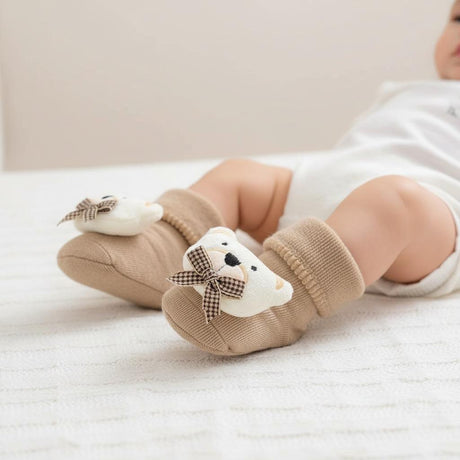 Camel ribbed cuff baby booties topped with an ivory bear head and brown gingham bow