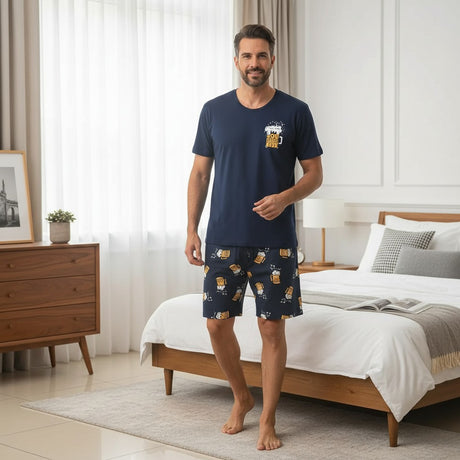Man wearing a navy beer print pyjama set with matching shorts