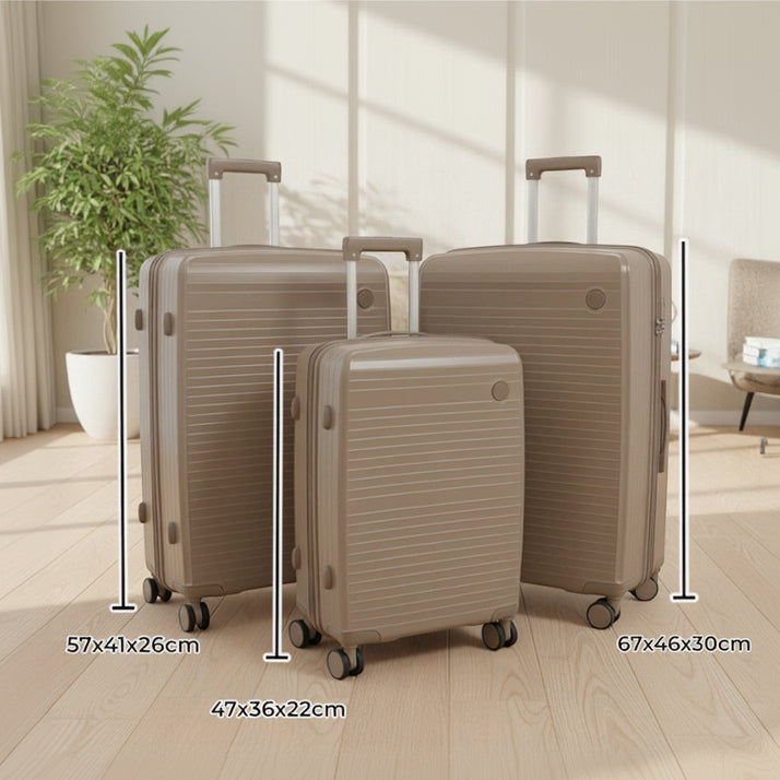 Beige hard shell luggage set of three with size labels