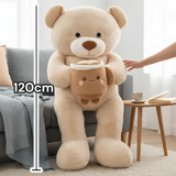 Beige teddy bear seated against a sofa with the latte cup plush and a 120cm line