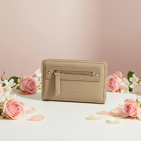 Beige classy wallet with pink roses and white flowers on a light pink background