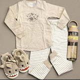 Beige teddy print pajama set flat lay with striped pants and shark slippers