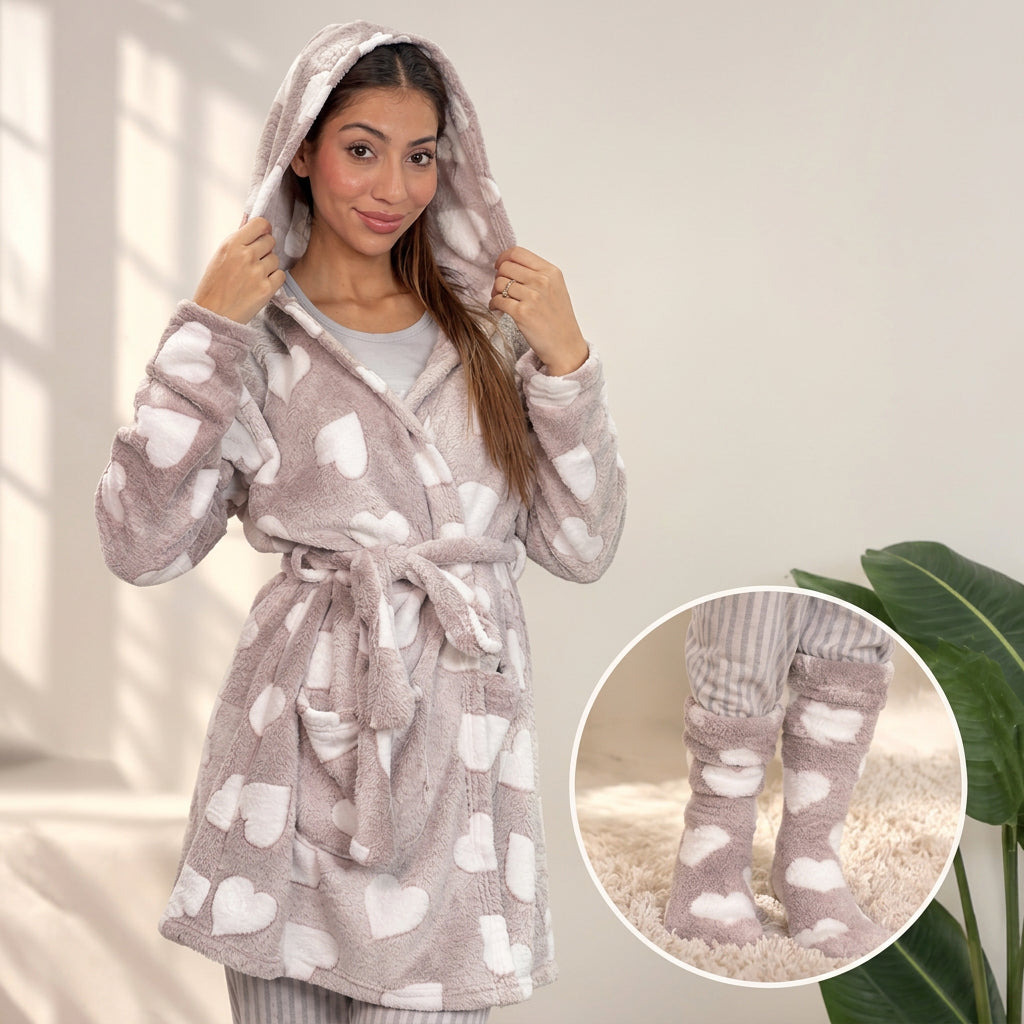 Woman in a hood up beige fleece robe with white hearts, with a close up of matching heart socks