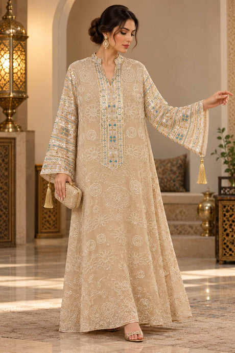 Woman in a beige jacquard kaftan with an embroidered front panel and wide bell sleeves