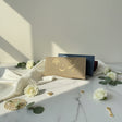 Beige woven long clutch wallet embroidered in gold with a cedar tree and Lebanon in Arabic