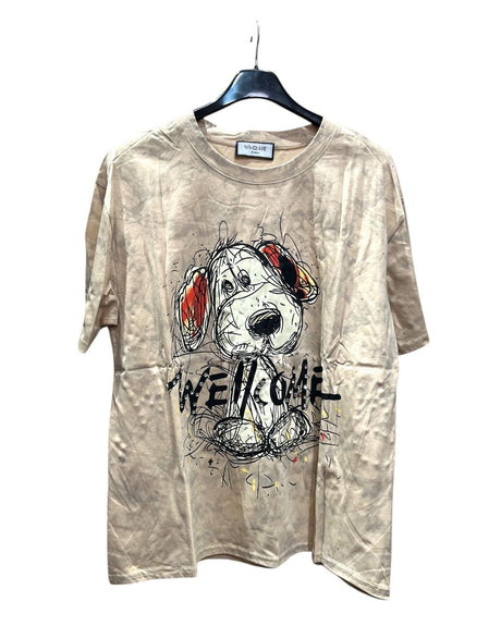 Oversized beige tshirt with dog graphic and 'WELCOME' text on a hanger