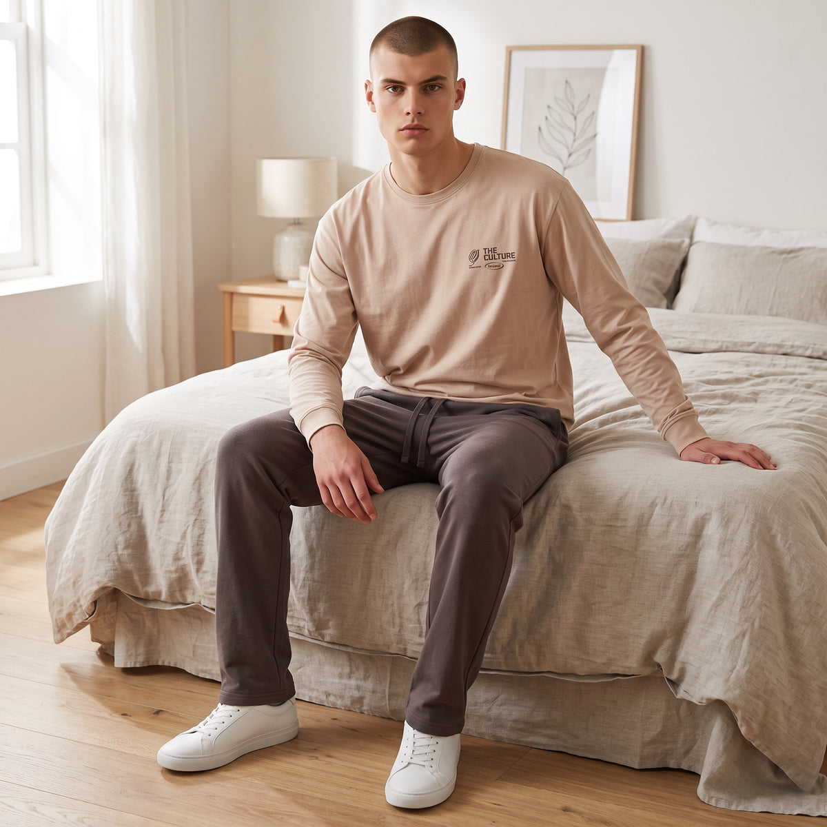 Men's sand beige pyjama top with a printed chest graphic and charcoal bottoms
