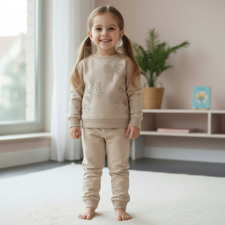 Beige sweatshirt with rose gold sequin bows and cuffed joggers