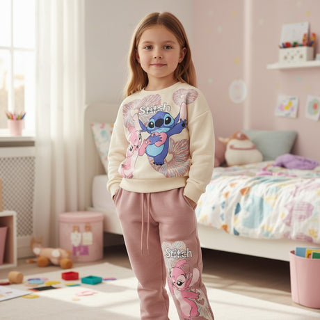 Girl wearing a cream Stitch and Angel sweatshirt with dusty pink printed jogger pants