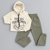 Cream hoodie with Test All Your Limits print laid out with army green joggers