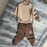 Beige tiger sweatshirt and brown joggers on hangers