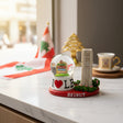 Snow globe with Lebanese signposts and a flag beside a clock tower on a red Beirut base