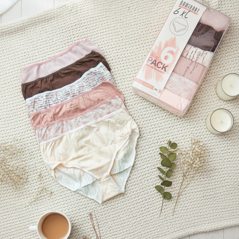 Neutral mix of blush, brown and cream full coverage briefs beside their box and a cup of tea