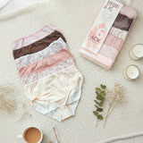 Neutral mix of blush, brown and cream full coverage briefs beside their box and a cup of tea