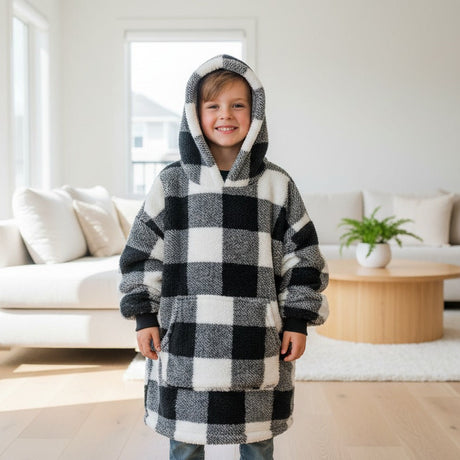 Child in a black and white check hooded blanket hoodie
