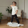 Boys cream tee with a black slogan print and black cargo joggers, two piece street set