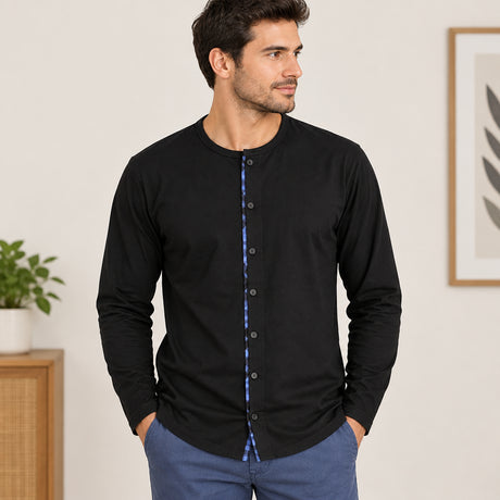 Close up of the black pyjama top with a full button placket and blue check trim