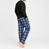 Side view of the black and blue check pyjama set against a plain white background