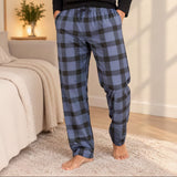 Close up of blue and black buffalo check pyjama trousers with side pockets
