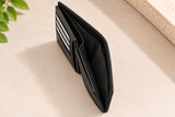 Side profile of the black coin pocket wallet showing its layered compartments