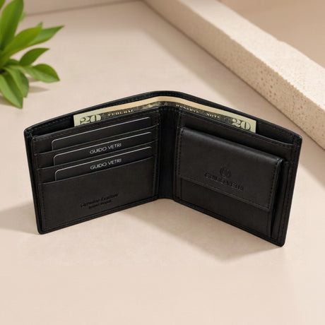 Snap flap coin purse beside a row of cards inside a smooth black leather wallet