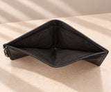 Open note compartment of the black compact wallet with its fabric lining visible