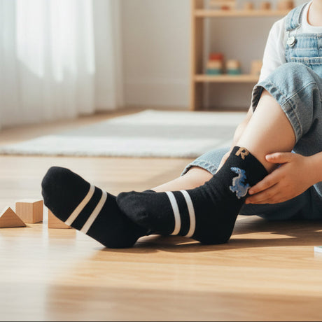 Kids black crew socks with a blue dinosaur motif and cream stripes, Jack Gifts Online Lebanon
