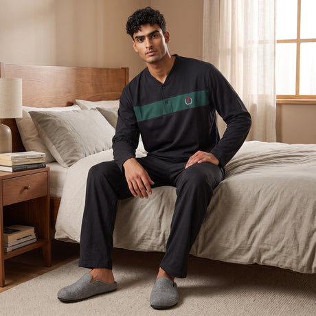 Men's black henley pyjama top with a green chest panel and plain black bottoms