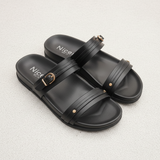 Black sandals with 'Nice' branding on a light gray background