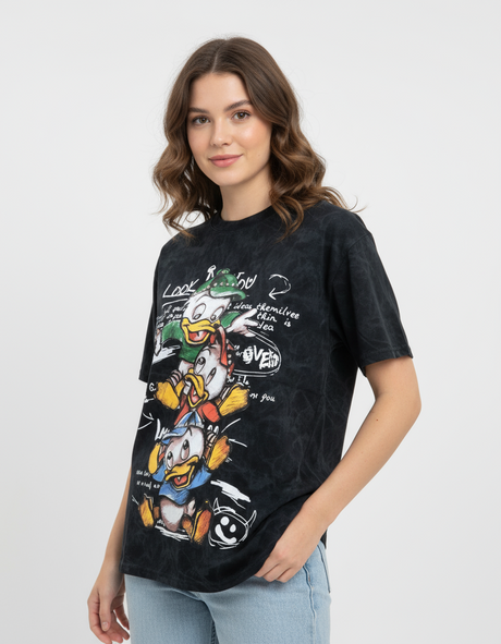 Woman wearing a black tshirt with cartoon duck character design on a white background