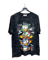 Oversized black tshirt with a colorful graphic print of cartoon ducks.