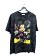 Black tshirt with colorful graphic design of miceky mouse on a hanger against a white background.